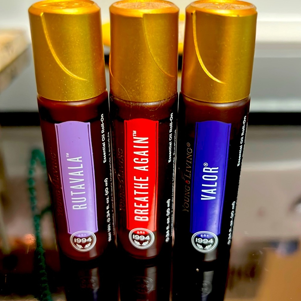 Young Living Roller bottles. Rutavala, Breathe Again, Valor.
